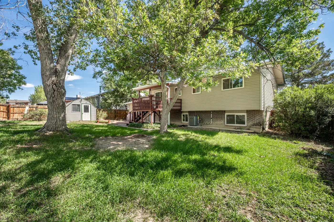 Large tree-shaded backyard at CMC North